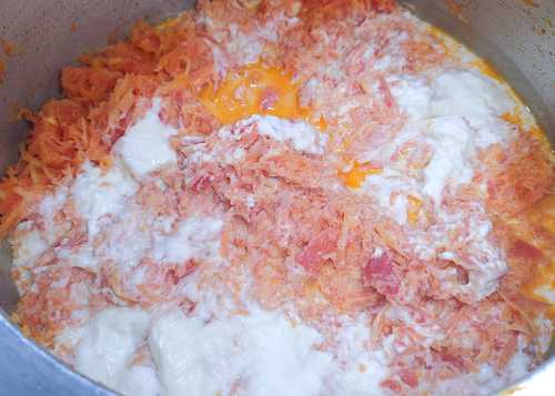 adding boiled milk and kesar for gajar halwa recipe