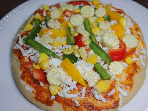 adding veggies to pizza recipe